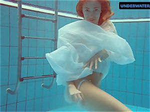 red-haired Diana molten and naughty in a milky dress